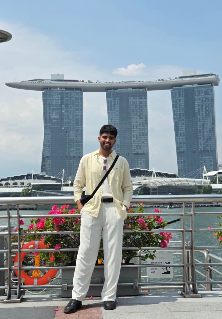 Dhruv in Singapore, Marina Bay Sands behind